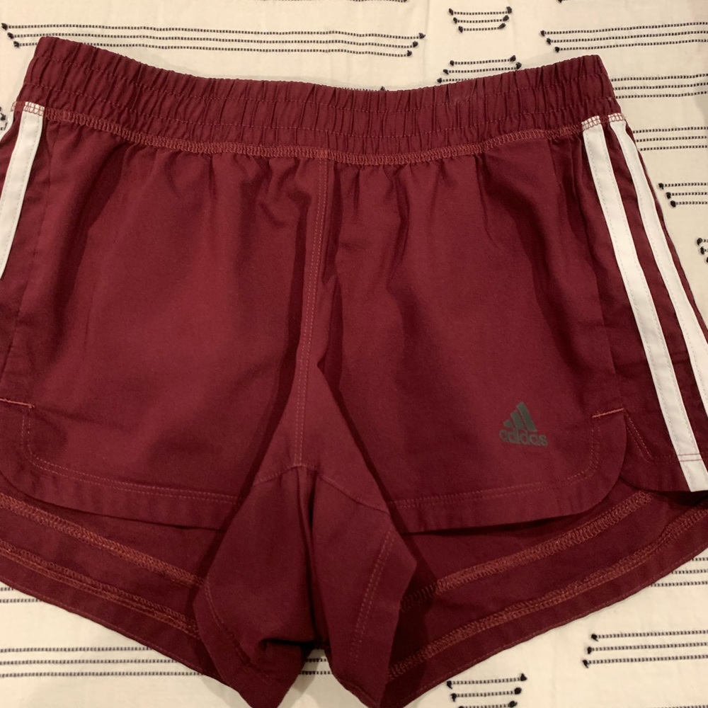 Maroon addidas running shorts